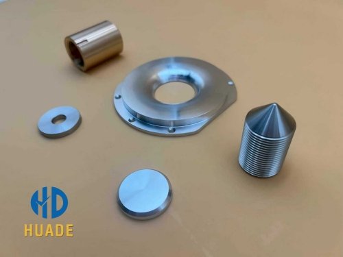 Assortment of custom compression driver parts manufactured with 5-axis CNC machining for professional audio applications.