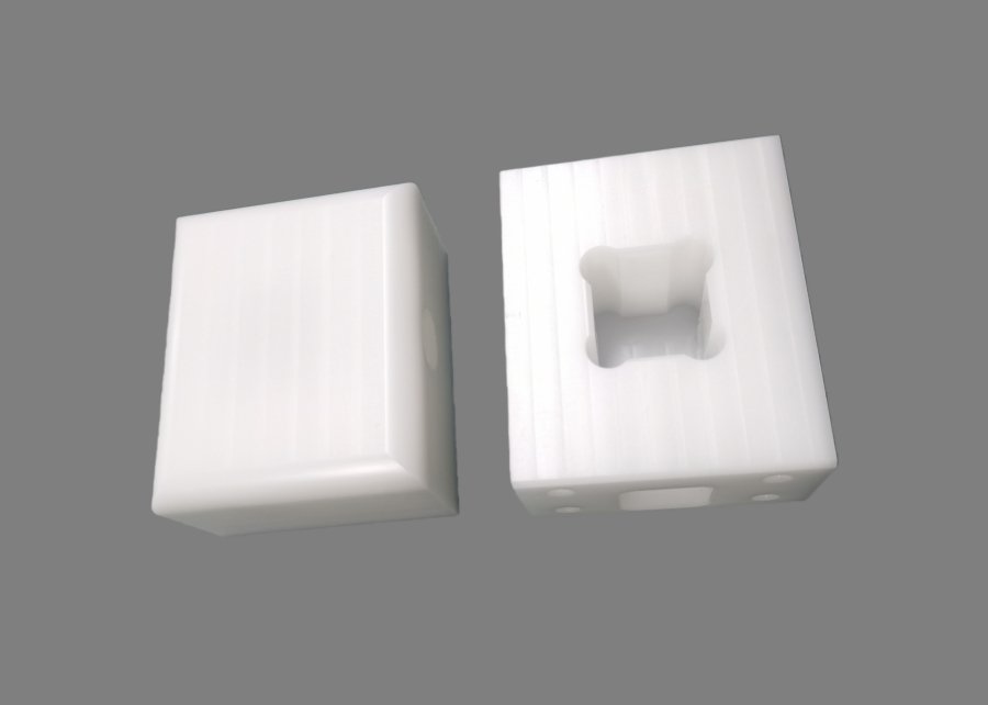 CNC machined ABS plastic prototype enclosure block with cavity and glossy Ra 0.8 μm finish, no burring